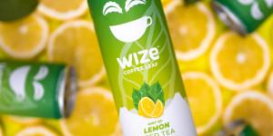 WIZE Coffee leaf can lemon flavour. The can is against a bright yellow background made of lemon slices. It looks refreshing!